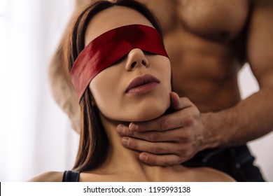 Couple. Sex. Role Play. Sexy Young Woman With A Blue Bandage On Her Eyes, Guy Is Touching Her Neck