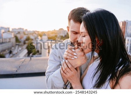 Similar – Image, Stock Photo Affectionate couple sharing a cozy moment on a sofa