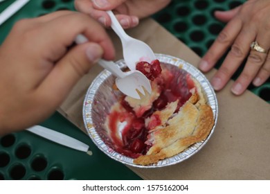 A couple sharing a pie