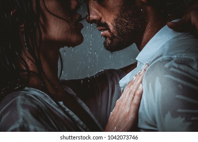 Couple Sharing Romantic Moments Under The Rain