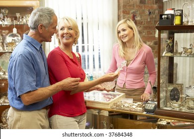 Couple Shopping In Antique Shop