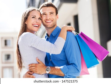 Couple With Shopping Bags