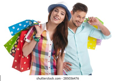 Couple With Shopping Bags. Studio Shoot