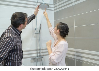 Couple Shopping For Bathroom Equipment In Hardware Store