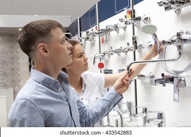 Couple Shopping For Bathroom Equipment In Hardware Store, Shop For Construction