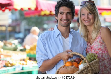 Couple Shopping At Local Market