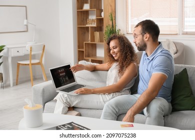 Couple shopping online on Black Friday at home