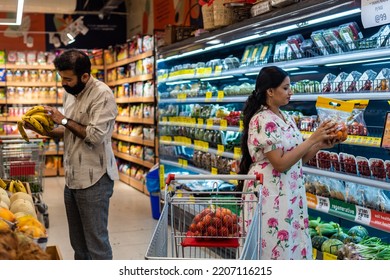 Couple Shops For Fresh Produce At The Supermarket.