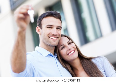 Couple Showing Their New House Keys