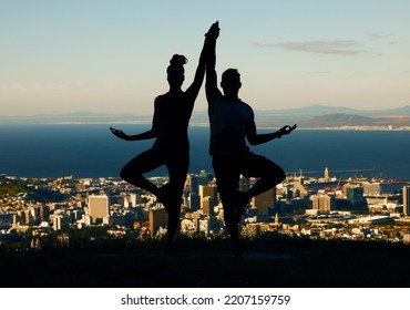 Couple, Silhouette And Yoga In Spiritual Fitness And Wellbeing Against A City Background. Dark Shadow Of People In Meditation Exercise Balance Together In Healthy Mind, Body And Spirit In Calm Nature