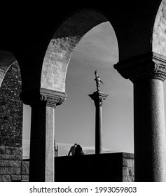 A Couple Sitting Next To Stockholms City Hall, Sweden.