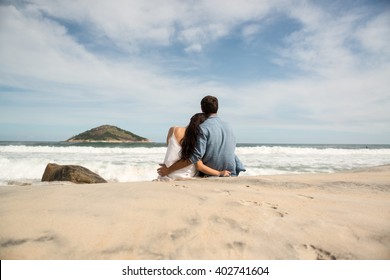 Couple sitting on the beach