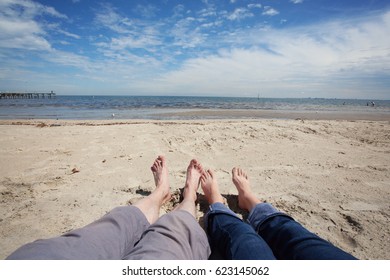 A Couple Sitting On Beach. Pov Wide Angle Shot. Melbourne, Australia.