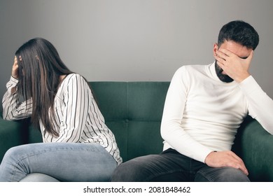 Couple Is Sitting On The Couch. Bad Relationship