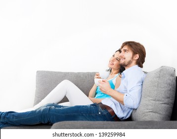 Couple Sitting On Couch, Sofa Looking Up To Copy Space Happy Smile Dream, Drink Coffee Hold Cup, Portrait Of Lovely Young Man And Woman Hug, Embrace