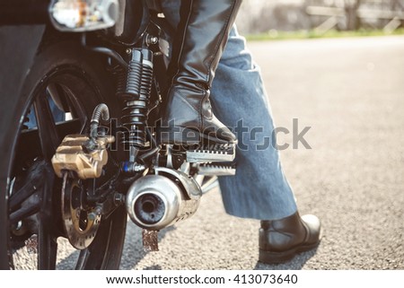 Similar – Couple sitting over motorcycle ready to go