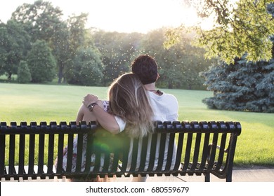 Couple Sitting Together On A Bench