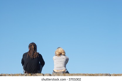 couple sitting under the sky