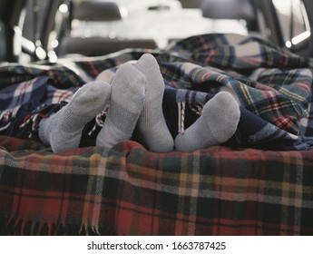 Couple Sleeping In The Back Of Their Car.