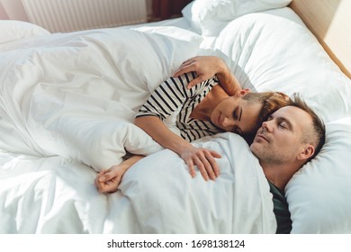 Couple Sleeping In The Bed