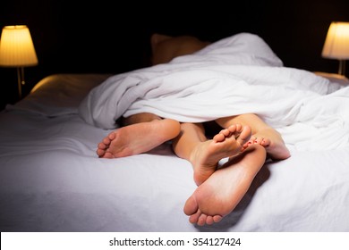 Couple Sleeping In Bed 