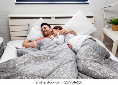 Couple sleeping in bed in bedroom - Powered by Shutterstock