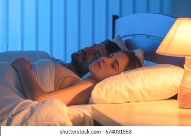 The Couple Sleeping In The Bed. Night Time, Full Grip Focus