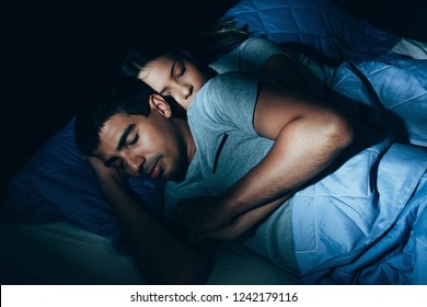 Couple sleeping in bed. The sleeping couple relax in the bed. night time