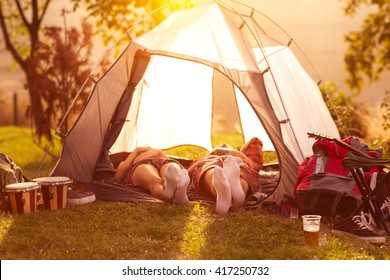 Couple sleeping in tent at early morning sun 