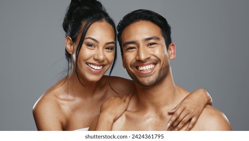 Couple, smile and care for skincare, happy and portrait for wellness in studio by gray background. Happy people, dermatology and hug for cosmetics, hydration and glow or love for skin treatment - Powered by Shutterstock