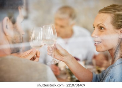 Couple, Smile And Champagne Toast At Dinner Celebrating In Home. Cheers, Love And Man, Woman And Sparkling Golden Wine Or Alcohol, Beverage Or Drink Celebration At Party, Event Or Family Gathering.