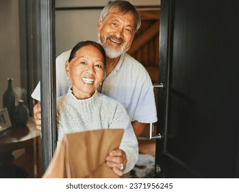 Couple, smile and happiness with front door for food delivery by service to house for retirement. Asian people, elderly and family by together, bond or care with excited on face for e commerce order - Powered by Shutterstock