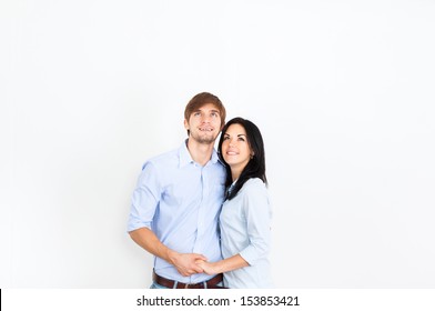 Couple Smile Look Empty Copy Space, At White Wall New House, Apartment, Love Smiling Embracing, Concept Beautiful Young Man And Woman Dream Think About Future Planning