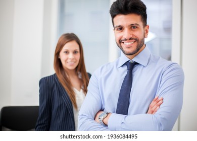 Couple Of Smiling Business People