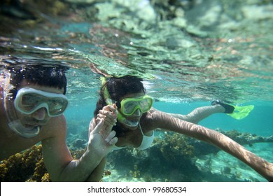 Couple Snorkeling In Caribbean Waters