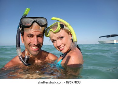 Couple with snorkeling equipment - Powered by Shutterstock