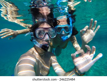 Couple Snorkeling In Maldives