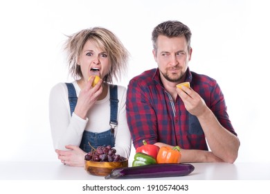 Couple Sobering Up With Lemon After A Party. Time For A Healthy Meal With Lemon And Vegies. Crazy Hair Day. 