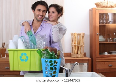 Couple sorting the recycling - Powered by Shutterstock