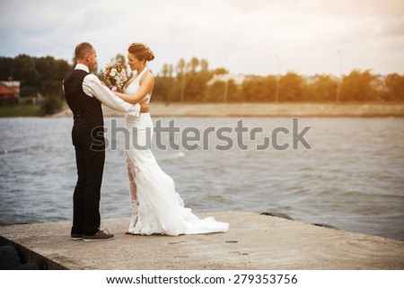 couple spending time at the lake on the pier