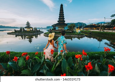Couple spending time at the ulun datu bratan temple in Bali. Concept about exotic lifestyle wanderlust traveling - Shutterstock ID 1463319173