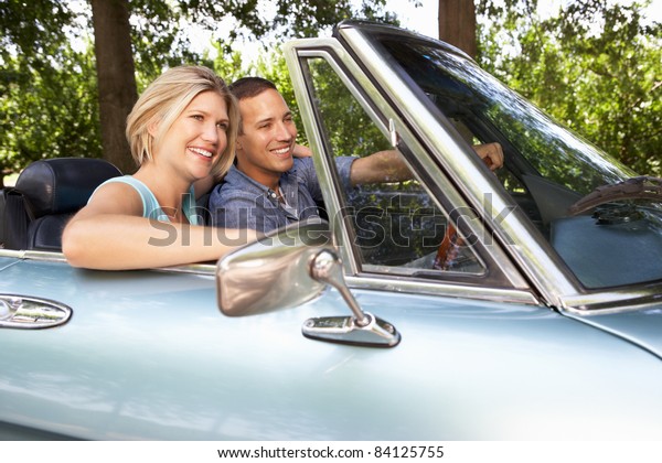 Couple in sports\
car
