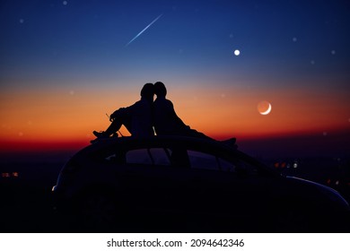 Couple Stargazing Together With A Astronomical Telescope.