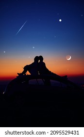 Couple Stargazing Together With A Astronomical Telescope.