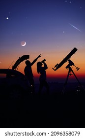 Couple Stargazing Together With A Astronomical Telescope.