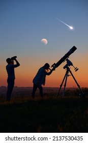 Couple Stargazing Together With A Astronomical Telescope, Looking At Planets, Stars, Lunar Eclipse And Meteor Shower.