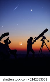 Couple Stargazing Together With A Astronomical Telescope.