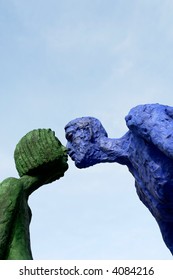 couple of statues giving a kiss in prague