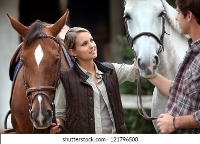 Couple Stood With Horse