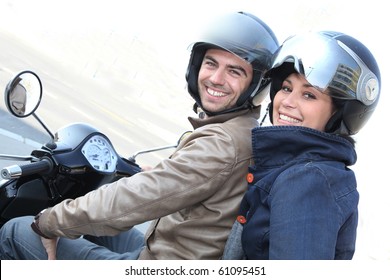 Couple Strolling On Motorcycle